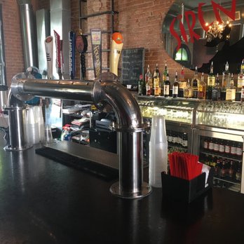 Sirens - a bar with a black counter top - Bars Near Me - Saint Johns, Michigan