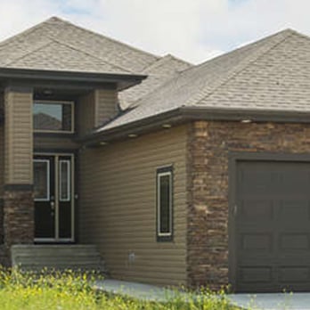 Poetry Homes - the front of a house with a garage - General Contractors Near Me - Edmonton, Alberta Poetry Homes - the front of a house with a garage - General Contractors Near Me - Edmonton, Alberta