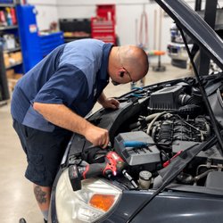 Western Mountain Auto Sales - ASE Certified Mechanic, Joe at Western Mountain Auto Service Center inspecting a car