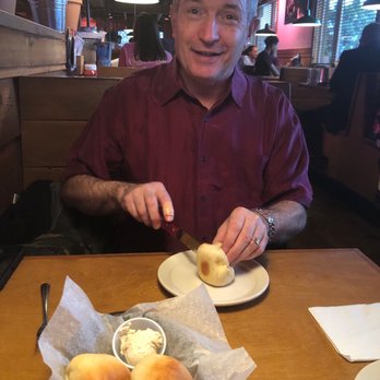 Texas Roadhouse - My hubby enjoying the bread. - Steakhouses Near Me - Columbus, Ohio