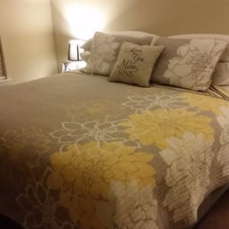 Our new king size bed! The bedding was purchased elsewhere.
