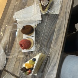 Basque cheese cake, coffee bean shaped cake, berry treasure, and fruit and cream cake
