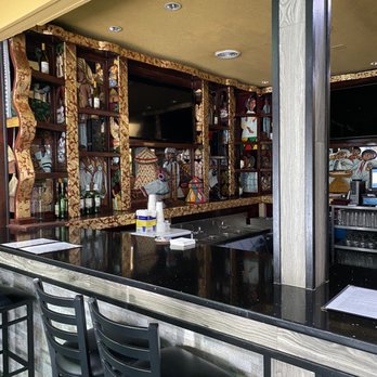 Axum Ethiopian Restaurant - a bar with black chairs - Ethiopian Near Me - Indianapolis, Indiana