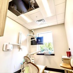Calm Family Dental - Our rooms provide noise canceling headphones, TV's on the ceiling, comfy chairs and large monitors to show your detailed treatment plans.