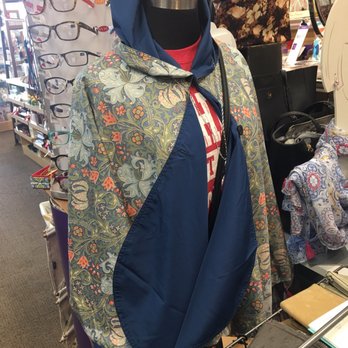 Bhushan's Hallmark - Reading glasses in the background. Ladies water proof poncho with hood and hidden magnets to keep it from billowing excessively. - Cards & Stationery Near Me - Fishkill, New York