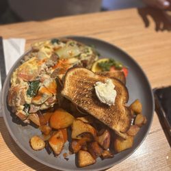 Artichoke Chicken Sausage Omelette with Cholula on top