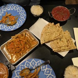 The Mango Tree CDA - Butter chicken poutine, butter chicken, chicken tikka masala, and garlic naan - so good!!