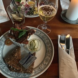 Restaurant Hornbæk Bodega - Chicken salad with rye bread (front) and a pilsner. Beef tartar (back).