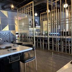 Omi Korean Grill - Omni's sleek contemporary dining area. Every table has a cooktop