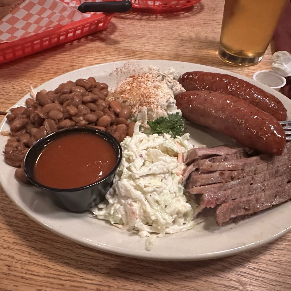 The State Line - 2 meat platter with Brisket - 2nd Cut Moist and Sausage.  Sades are beans, slaw and tater salad. - Barbeque Near Me - El Paso, Texas