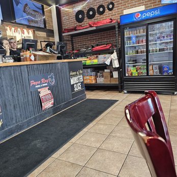 Papa Ray's Pizza & Wings - The order/pick up and fridge for to go drinks. There's a fountain drink o the left for eat in orders. - Pizza Near Me - Des Plaines, Illinois Papa Ray's Pizza & Wings - The order/pick up and fridge for to go drinks. There's a fountain drink o the left for eat in orders. - Pizza Near Me - Des Plaines, Illinois