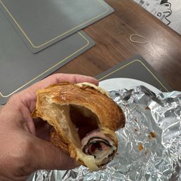 Inside of the ham and cheese croissant. Missing the airy layers. Inside of the ham and cheese croissant. Missing the airy layers.