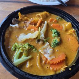 Yellow curry, side of steamed veggies Yellow curry, side of steamed veggies