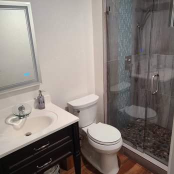 Element Construction and Restoration - Pebble shower with waterfall effect - Damage Restoration Near Me Element Construction and Restoration - Pebble shower with waterfall effect - Damage Restoration Near Me