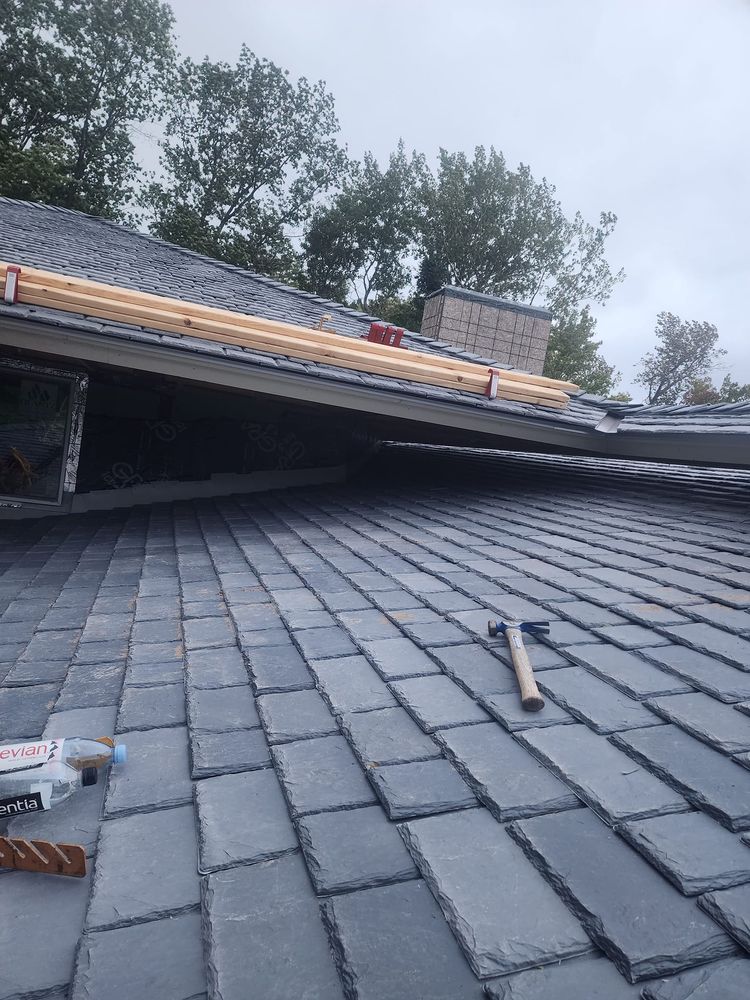 Slide of Archyk Roofing