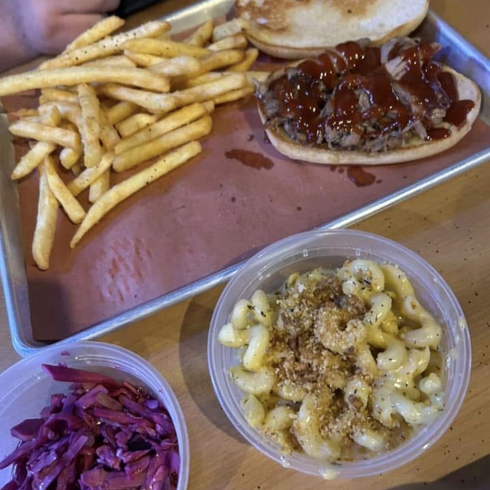 Mac and cheese, slaw on the side, pulled pork sandwich, and fries
