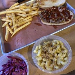 Mac and cheese, slaw on the side, pulled pork sandwich, and fries Mac and cheese, slaw on the side, pulled pork sandwich, and fries