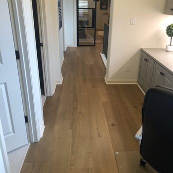Castle Flooring - a view of a hallway leading to a kitchen - Flooring Near Me - Austin, Texas Castle Flooring - a view of a hallway leading to a kitchen - Flooring Near Me - Austin, Texas