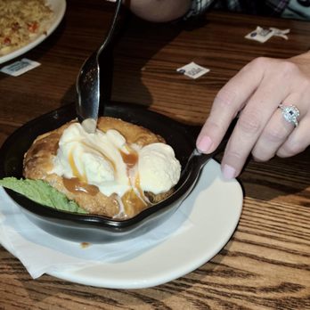 Outback Steakhouse - Caramel cookie dessert and my newly engaged hand. - Steakhouses Near Me - Asheville, North Carolina