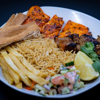 Watani Spot - a plate of food with meat, rice, and french fries - Food Trucks Near Me - Burlingame, California Watani Spot - a plate of food with meat, rice, and french fries - Food Trucks Near Me - Burlingame, California