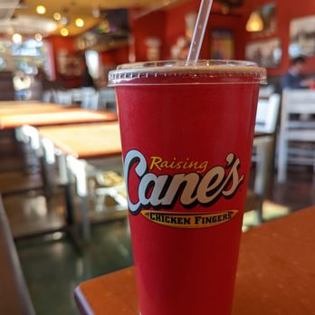 Raising Cane's Chicken Fingers - Fountain drink with lobby in background - Chicken Wings Near Me - Lafayette, Louisiana