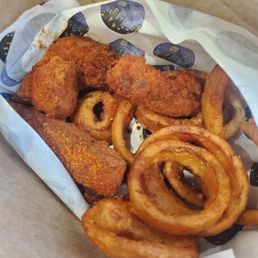 Nash hot chicken tenders with a side of onion rings