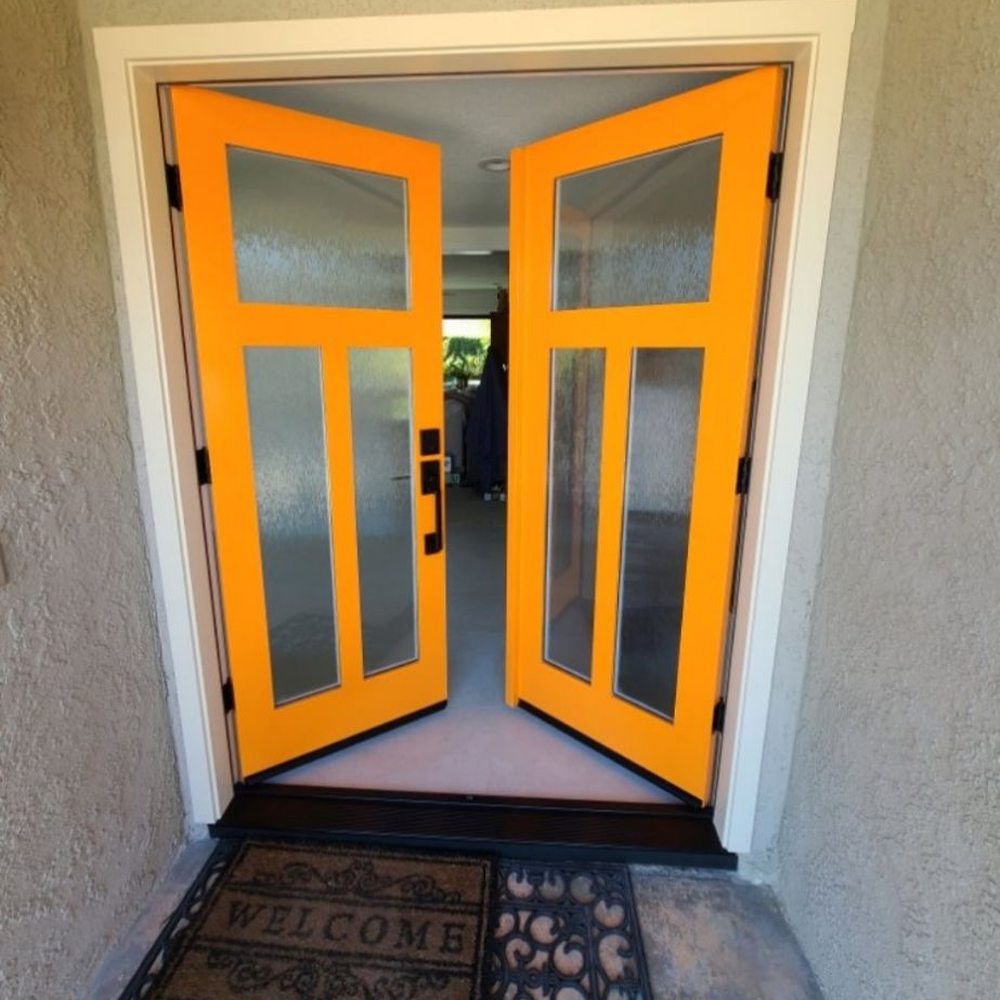 Efficient Construction - Newly installed doors with mango orange color. - Roofing Near Me - Gardena, California