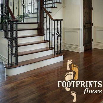 Footprints Floors Madison - a staircase with a wooden handrail - Flooring Near Me Footprints Floors Madison - a staircase with a wooden handrail - Flooring Near Me