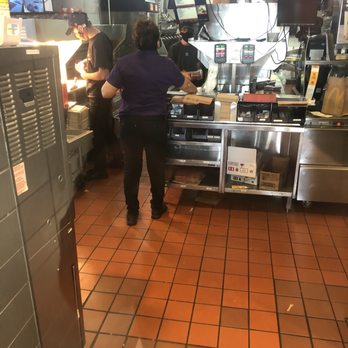 McDonald's - a woman preparing food in the kitchen - Fast Food Near Me - Perris, California