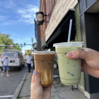 The Bean Coffee House - a hand holding a cup of iced coffee - Coffee & Tea Near Me - North East, Pennsylvania The Bean Coffee House - a hand holding a cup of iced coffee - Coffee & Tea Near Me - North East, Pennsylvania
