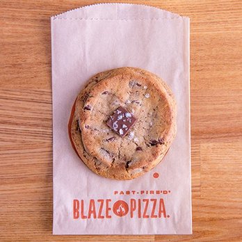 Blaze Pizza - a chocolate chip cookie on a paper bag - Salad Near Me - Stephenville, Texas