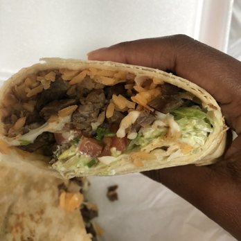 Las Daisy's Taqueria - a hand holding a burrito - Mexican Near Me - Euless, Texas Las Daisy's Taqueria - a hand holding a burrito - Mexican Near Me - Euless, Texas