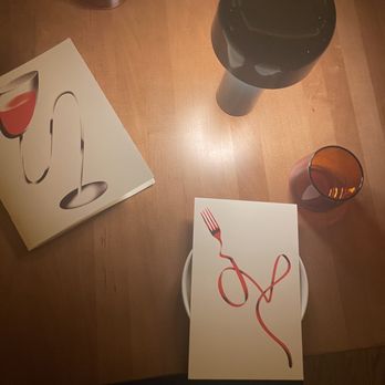 Bad Idea - dinner table with drink(wine) and food menu - Wine Bars Near Me - Nashville, Tennessee