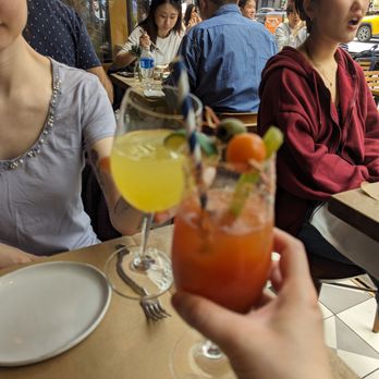 L'Amico - Cheers! Glass of OJ and a Bloody Mary - Italian Near Me - New York, New York