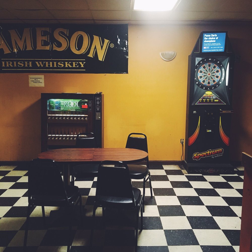 Huddle's Cafe - a game room with a checkered floor - Dive Bars Near Me - Newport, Kentucky