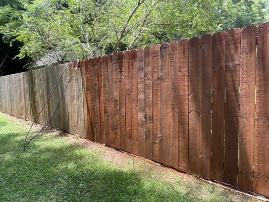 6' privacy wood fence staining and seal application. - We gave this fence a fresh new look with a stain and seal treatment. The stain brings out the natural beauty of the wood, while the seal helps protect it from the sun, rain, and everyday wear. Now the fence not only looks great but will last much longer, too!