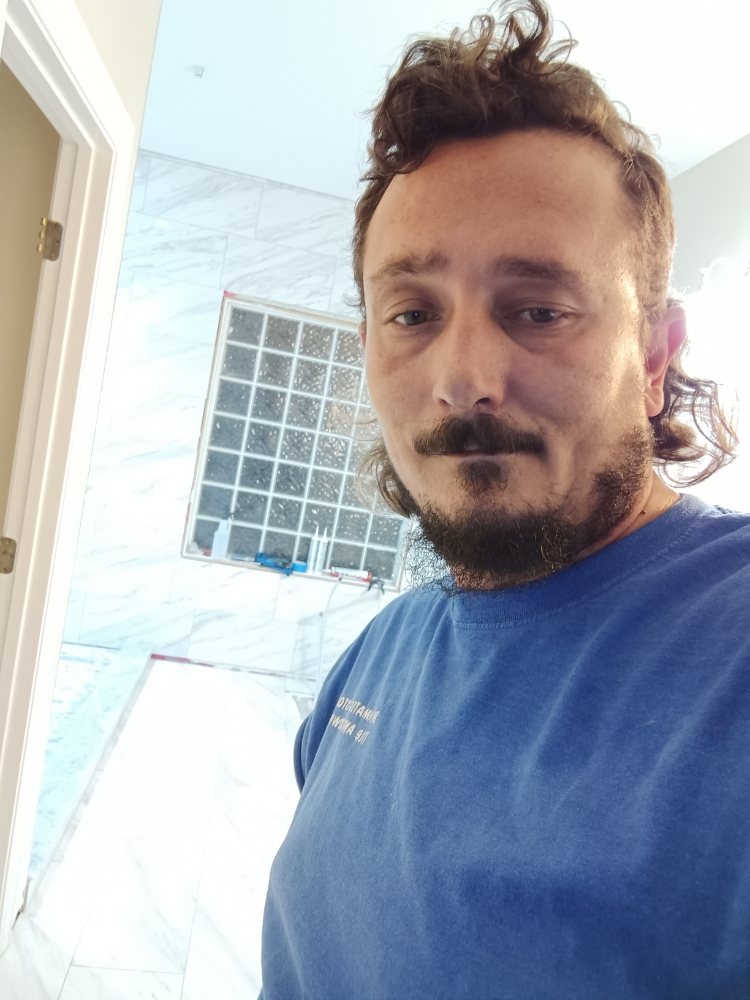 Slide of Bathmatic Custom Tile and Shower