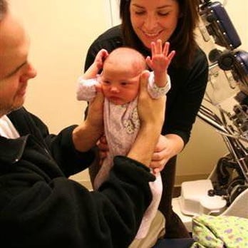 Queen Anne Chiropractic Center - Dr. Sarah providing a chiropractic adjustment to a newborn baby. - Chiropractors Near Me - Seattle, Washington Queen Anne Chiropractic Center - Dr. Sarah providing a chiropractic adjustment to a newborn baby. - Chiropractors Near Me - Seattle, Washington