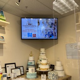 a cake display with a flat screen tv a cake display with a flat screen tv
