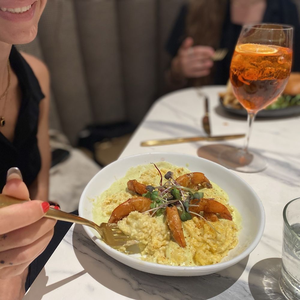 Fern In The Wild - Shrimp and grits with an Aperol Spritz - Coffee & Tea Near Me - Ennis, Texas Fern In The Wild - Shrimp and grits with an Aperol Spritz - Coffee & Tea Near Me - Ennis, Texas