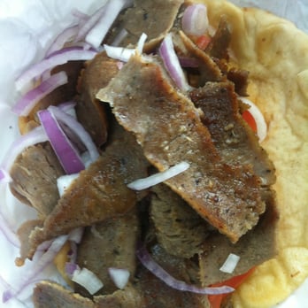 Greek Style Chicken - Gyro Sandwich stuffed with flavorful sliced meat. - Greek Near Me - Fallbrook, California Greek Style Chicken - Gyro Sandwich stuffed with flavorful sliced meat. - Greek Near Me - Fallbrook, California