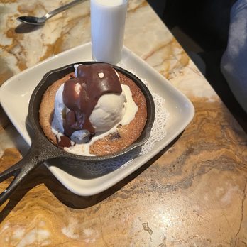 Daniel's Broiler - Bellevue - Cookie with ice cream and topped with fudge - Steakhouses Near Me - Bellevue, Washington
