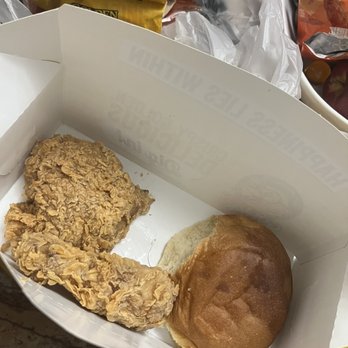 Golden Chick - a half eaten sandwich and a bag of chips - Fast Food Near Me - Lockhart, Texas