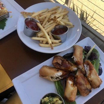 The Beachcomber - Fries and spring rolls at the bar - Seafood Near Me - Newport Beach, California The Beachcomber - Fries and spring rolls at the bar - Seafood Near Me - Newport Beach, California