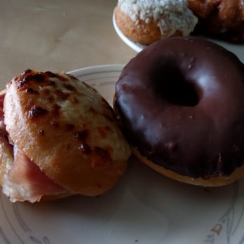 Revolution Doughnuts - (left) crunchy mister and (right) dark chocolate yeast doughnut - Donuts Near Me - Decatur, Georgia