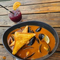 Las Brasas - Aji Panca Mussels paired with Sangria Peru
