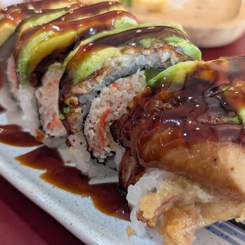 Sushi Samurai - Flavorful Scorpion Roll with crunchy, soft-shell crab, tasty crab salad, and creamy avocado slides, topped with eel and an amazing sauce. - Sushi Bars Near Me - Orchard Lake, Michigan Sushi Samurai - Flavorful Scorpion Roll with crunchy, soft-shell crab, tasty crab salad, and creamy avocado slides, topped with eel and an amazing sauce. - Sushi Bars Near Me - Orchard Lake, Michigan