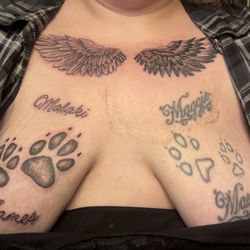 One of A Kind Tattoos - Maggie Mae and paw prints done in 2013, Malaki James ,paw prints and wings added today(3/25/25)