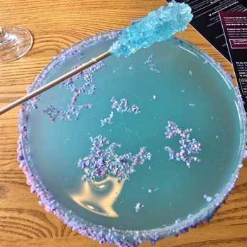 Stir Martini Bar & Kitchen - A cotton candy martini with a swizzle stick of rock candy - Cocktail Bars Near Me - Westford, Massachusetts Stir Martini Bar & Kitchen - A cotton candy martini with a swizzle stick of rock candy - Cocktail Bars Near Me - Westford, Massachusetts
