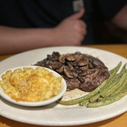 Black Angus Steakhouse - Rib Eye Steak w/ mushrooms and side of Mac n Cheese and roasted green beans
